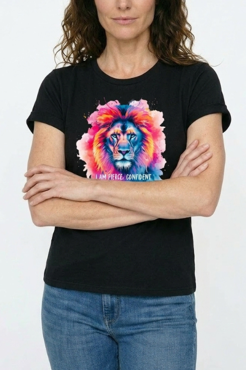 Person wearing a black t-shirt with a colorful lion graphic and text.