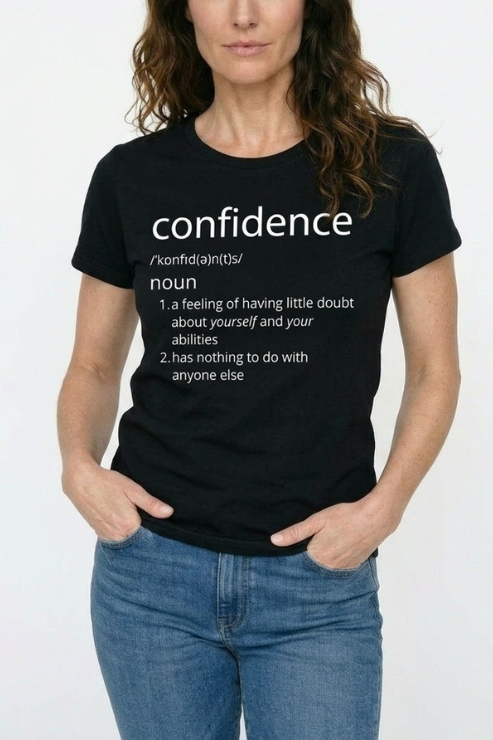 Person wearing a black t-shirt with 'confidence' definition text