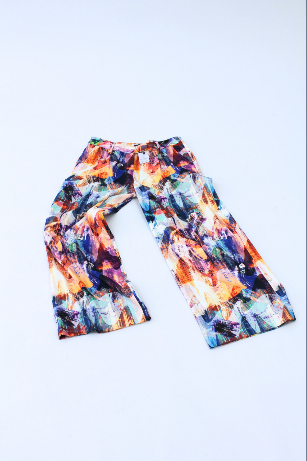 Colorful patterned pants on a light blue background