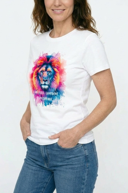 Person wearing a white t-shirt with a colorful lion graphic and text.