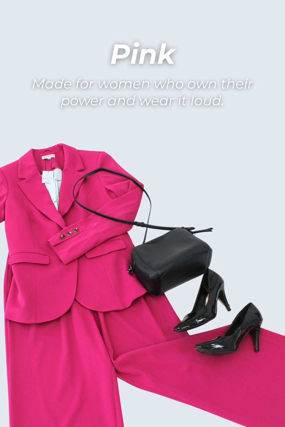 Pink suit with black handbag and shoes on a light gray background with text 'Pink: Made for women who own their power and wear it loud'.