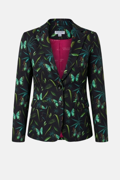 A women's tailored blazer with a black base covered in a vibrant green tropical leaf and butterfly print, featuring a contrasting bright pink inner lining visible at the collar and front opening.