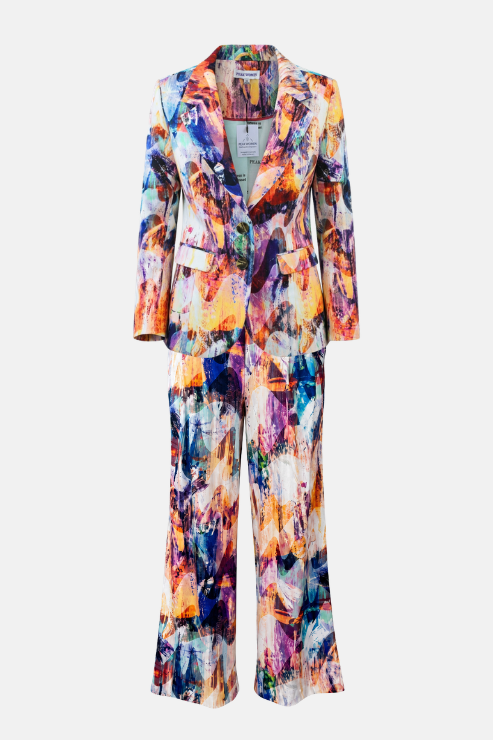 A women's two-piece suit set featuring a cropped blazer and matching wide-leg trousers, both decorated with a vibrant, multicolored abstract painterly print on a white base.