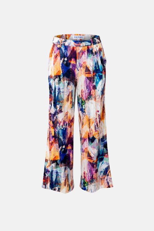 A pair of wide-leg cropped pants featuring an abstract, multicolored paint-splatter pattern with prominent shades of blue, purple, orange, and white, displayed on a clean white background.