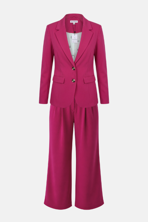 A bright magenta two-piece suit set consisting of a tailored blazer with two front buttons and matching wide-leg trousers, displayed on a clean light gray background.